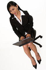 Image showing Woman sitting and working on laptop