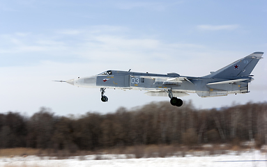 Image showing Military jet bomber Su-24 Fencer flying