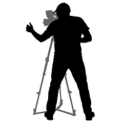 Image showing Cameraman with video camera. Silhouettes on white background