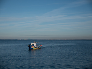 Image showing Motor boat sailing away on the waves of the sea