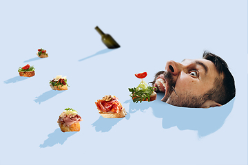 Image showing Tapas and wine bottle are descending with the river like ships straight to big male mouth just like to the cave