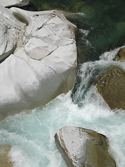 Image showing grey polished rocks and green river water