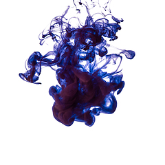 Image showing Explosion of colored, fluid and neoned liquids on white studio background with copyspace