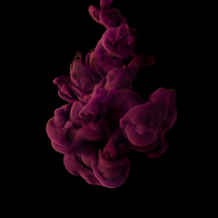 Image showing Explosion of colored, fluid and neoned liquids on black studio background with copyspace
