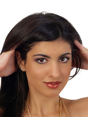 Image showing Young middle eastern woman portrait with hands in hair