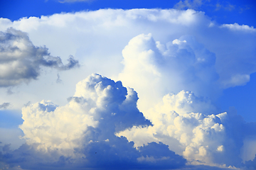 Image showing Big white clouds on blue sky. Heaven view