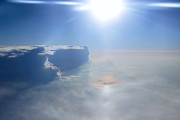 Image showing Wonderful view from window of plane in morning sun over clouds