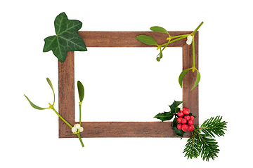 Image showing Abstract Wooden Frame with Winter Greenery