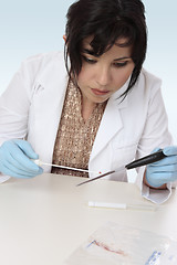 Image showing Forensic scientist obtaining sample 