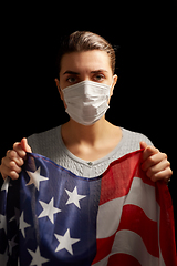 Image showing sick woman in face mask holding flag of america