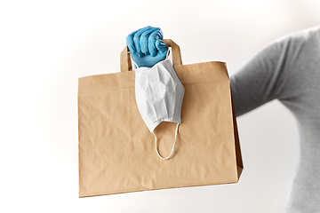 Image showing woman with shopping bag, face mask and gloves