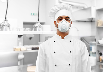 Image showing male chef in respirator at restaurant kitchen