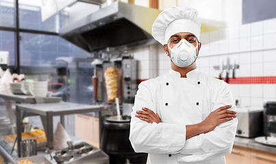 Image showing male chef with in respirator at kebab shop kitchen