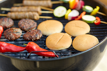 Image showing barbecue kebab meat and vegetables on grill