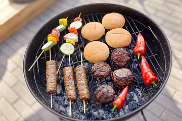 Image showing barbecue kebab meat and vegetables on grill