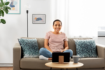 Image showing african american woman with tablet pc at home