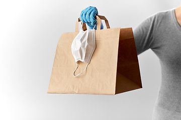 Image showing woman with shopping bag, face mask and gloves