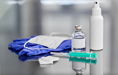 Image showing syringe, medicine, wound wipes, gloves and mask