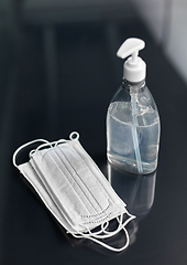 Image showing hand sanitizer or liquid soap and medical masks