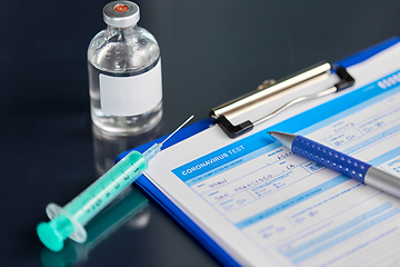 Image showing medical report, pen, syringe and medicine