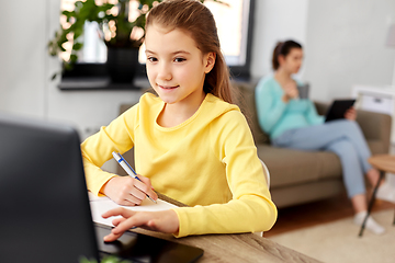 Image showing student girl with laptop learning online at home