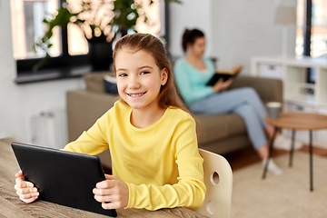Image showing student girl with tablet pc and mother at home