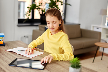 Image showing student girl writing to notebook at home