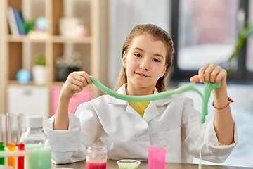 Image showing girl playing with slime at home laboratory