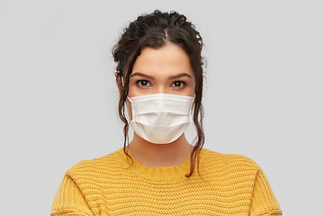 Image showing young woman in protective medical mask