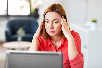 Image showing stressed woman with laptop working at home office