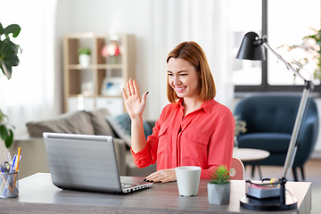 Image showing woman with laptop having video call at home office