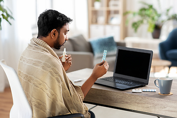 Image showing sick man thermometer having video call on laptop