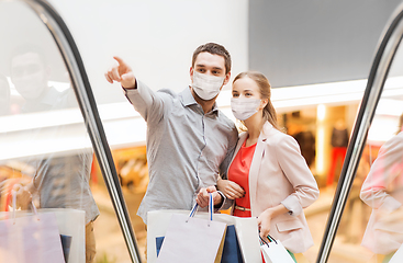 Image showing happy young couple with shopping bags in mall