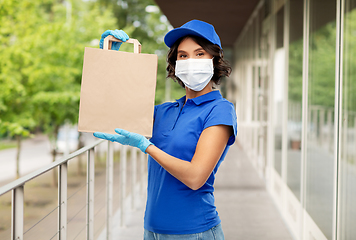 Image showing delivery woman in face mask with food in paper bag