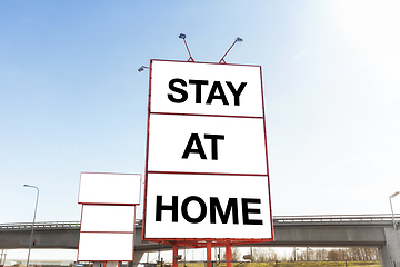 Image showing big billboard with stay at home words in city