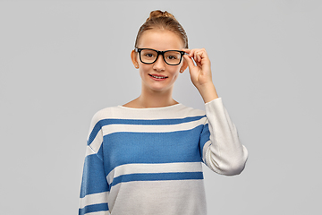 Image showing smiling teenage student girl in glasses