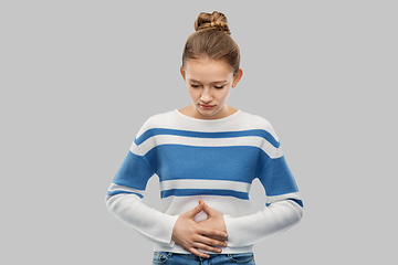 Image showing teenage girl having stomach ache