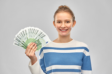 Image showing smiling teenage girl with euro money banknotes