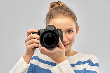 Image showing smiling teenage girl r with digital camera