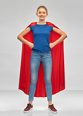 Image showing smiling teenage girl in red superhero cape