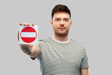 Image showing young man showing stop sign