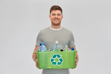 Image showing smiling young man sorting plastic waste