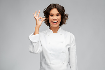 Image showing happy smiling female chef showing ok hand sign