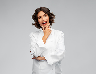 Image showing smiling female chef thinking