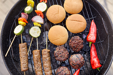 Image showing barbecue kebab meat and vegetables on grill
