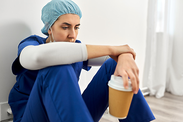 Image showing sad doctor or nurse with cup of takeaway coffee