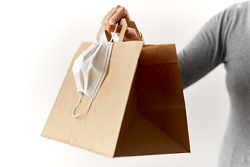 Image showing woman with shopping bag and face protective mask