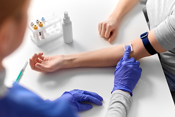 Image showing doctor and patient taking blood for test