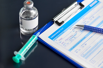 Image showing medical report, pen, syringe and medicine