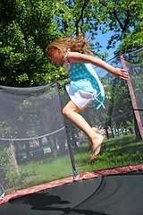 Image showing girl jumps on the trampoline